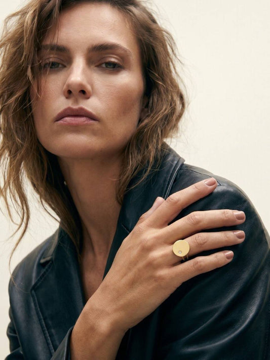 Round gold ring with stone