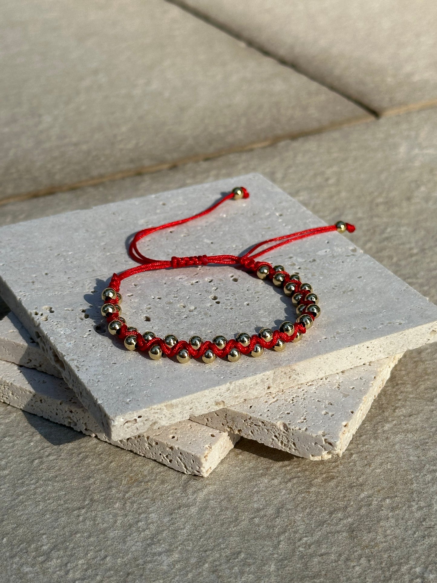 Braided bracelet medium 'Red w/gold details'